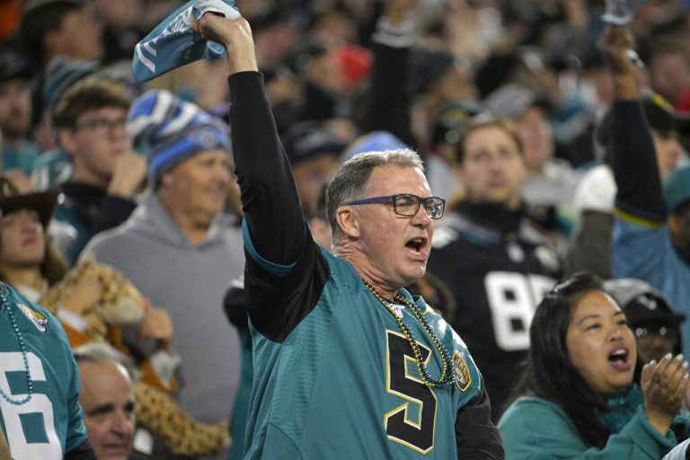 Jacksonville Jaguars fans cheer in the stands during the second half of an NFL football game against the Tennessee Titans, Saturday, Jan. 7, 2023, in Jacksonville, Fla.