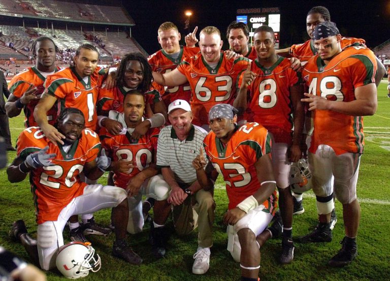 Miami Hurricanes head coach Larry Coker, center, poses with senior students of his National Championship football team following their final home game against Washington this past season on Nov. 24, 2001 at the Orange Bowl in Miami. Chris Campbell (48), far right, was killed in a car accident early Saturday Feb. 16, 2002 in Coral Gables, Fla.