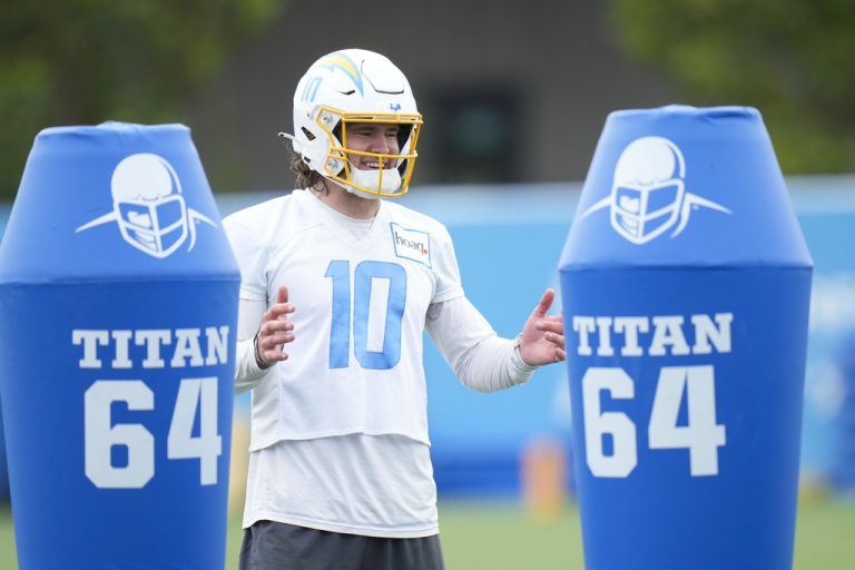 Los Angeles Chargers quarterback Justin Herbert (10) smiles during the NFL football team's camp in Costa Mesa, Calif., Tuesday, June 13, 2023.